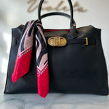 Black Liu Jo handbag with decorative scarf